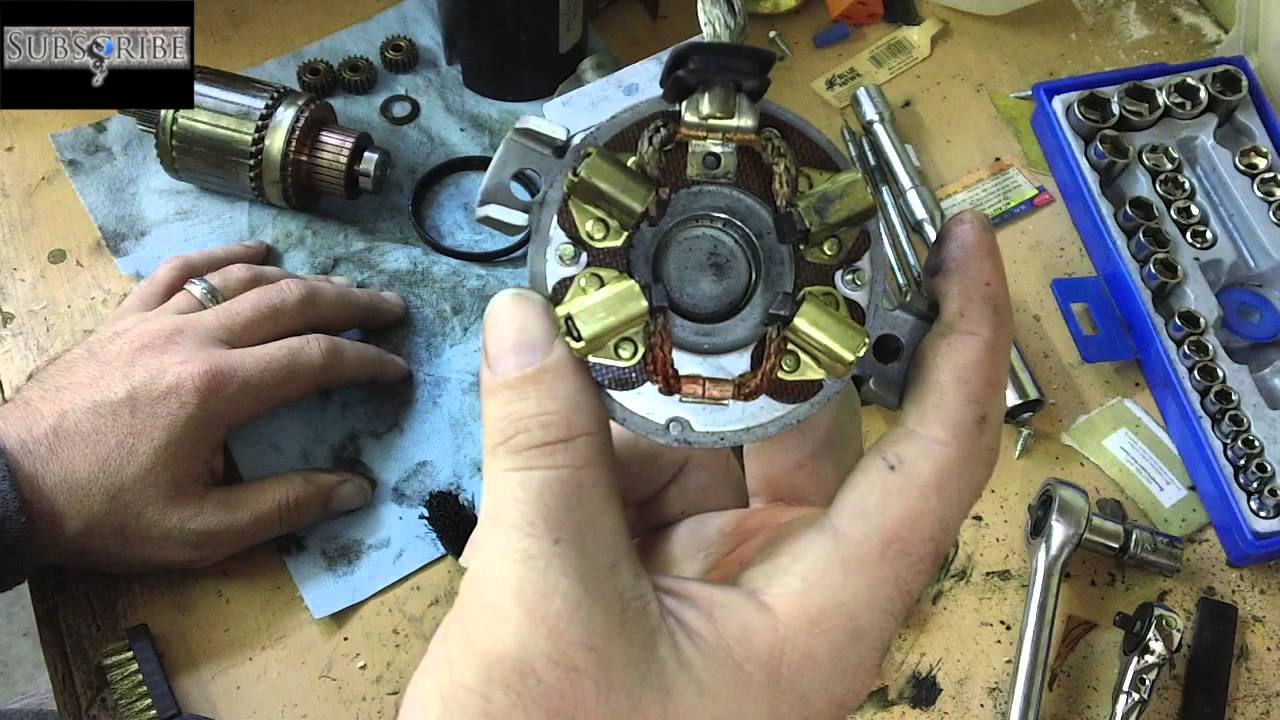 The parts of a starter being cleaned